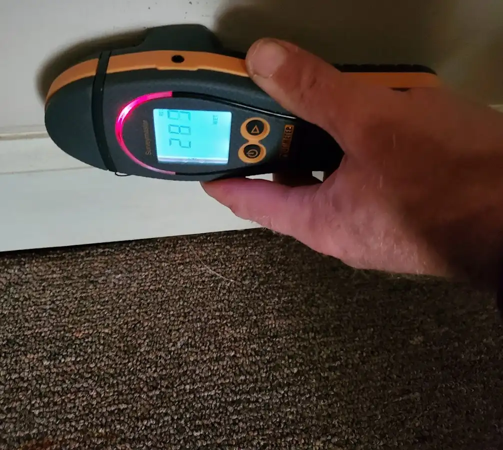 Moisture detection at baseboard during Storm Damage Restoration in Jurupa Valley
